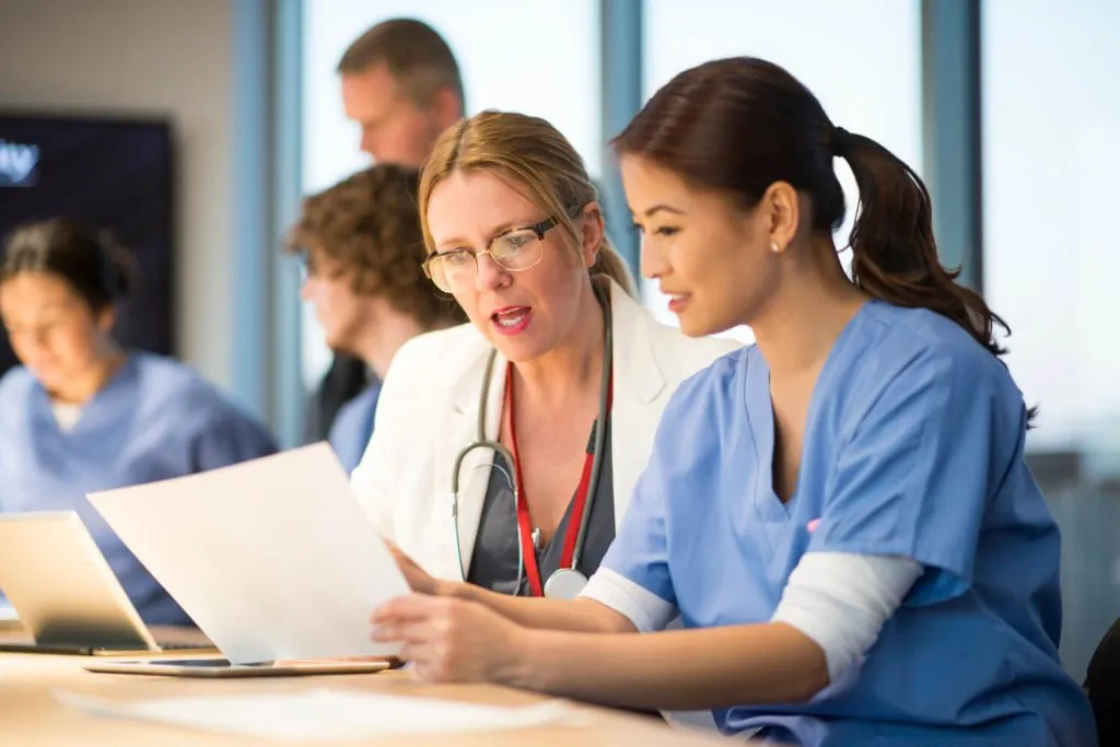 Healthcare professionals collaborating on credentialing